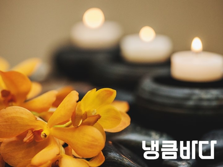 flowers-and-stones-with-blurred-candles.jpg