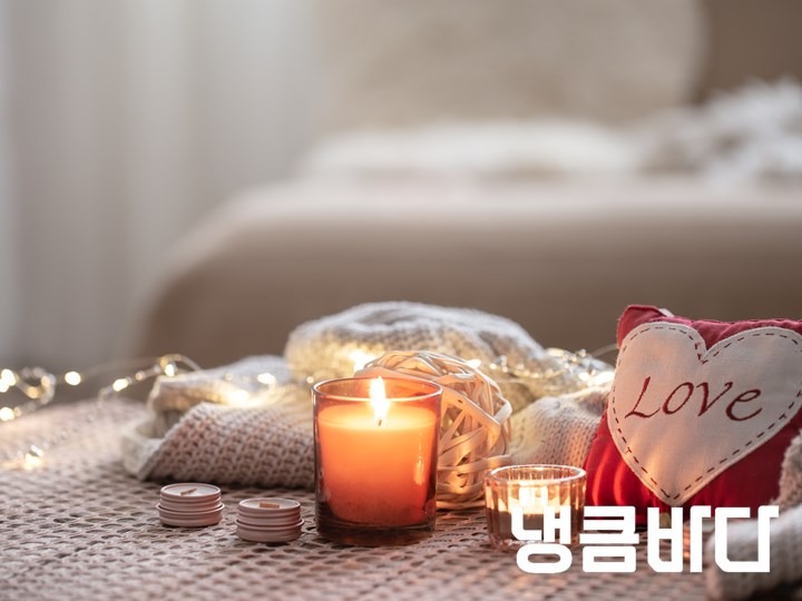 cozy-valentines-day-background-with-a-candle-and-a-decorative-heart.jpg
